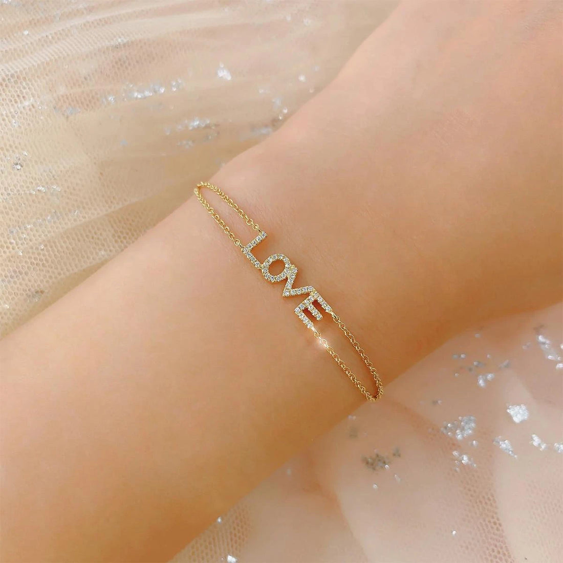 DIAMOND "LOVE" BRACELET IN 14K YELLOW GOLD