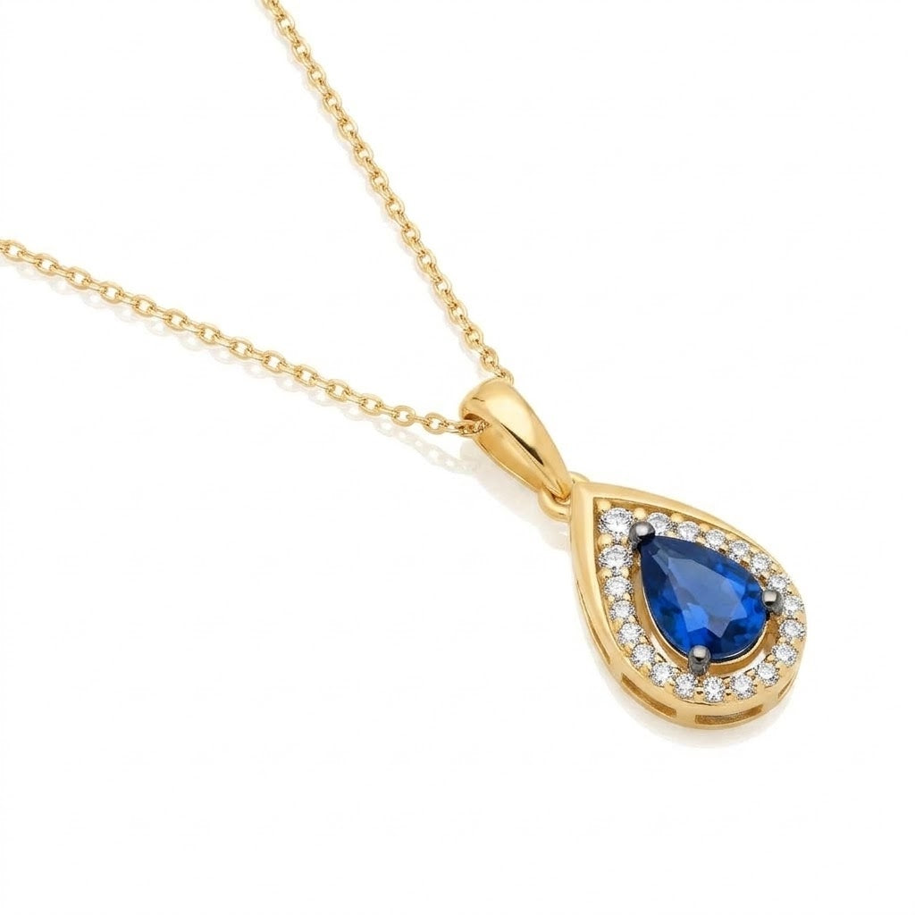 .45 TOTAL CARAT WEIGHT PEAR SHAPED BLUE SAPPHIRE & .11 TOTAL CARAT WEIGHT ROUND DIAMOND HALO PENDANT IN 14K YELLOW GOLD