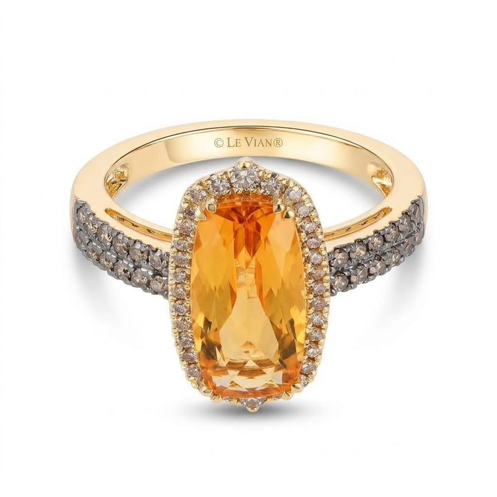 3.60 CARAT OVAL ORANGE CITRINE WITH .55 TOTAL CARAT WEIGHT WHITE DIAMOND HALO RING WITH CHOCOLATE DIAMONDS ON THE BAND