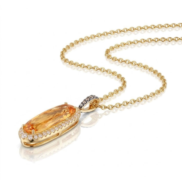 2.60 CARAT OVAL CITRINE WITH .31 TOTAL CARAT WEIGHT WHITE AND CHOCOLATE DIAMOND PENDANT IN 14K YELLOW GOLD
