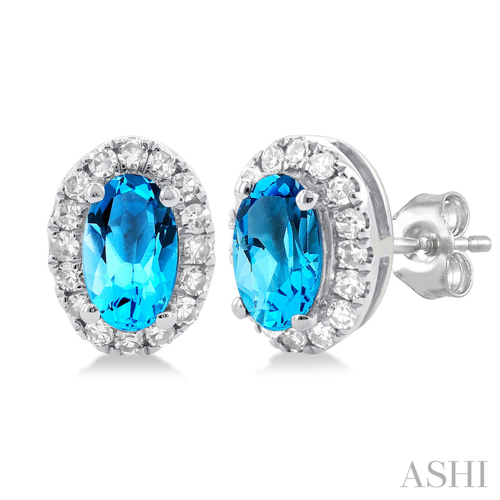 Oval Blue Topaz Diamond Halo Stud Earrings | 10K White Gold | 0.13 ctw | Friction Back - Brownee Jewelers