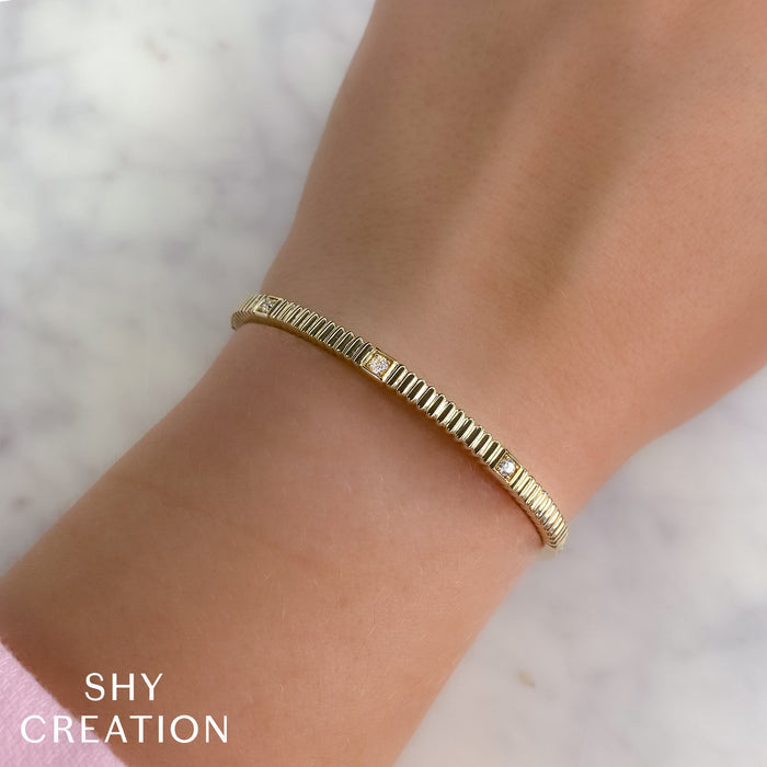 0.16CT DIAMOND BANGLE IN 14K YELLOW GOLD