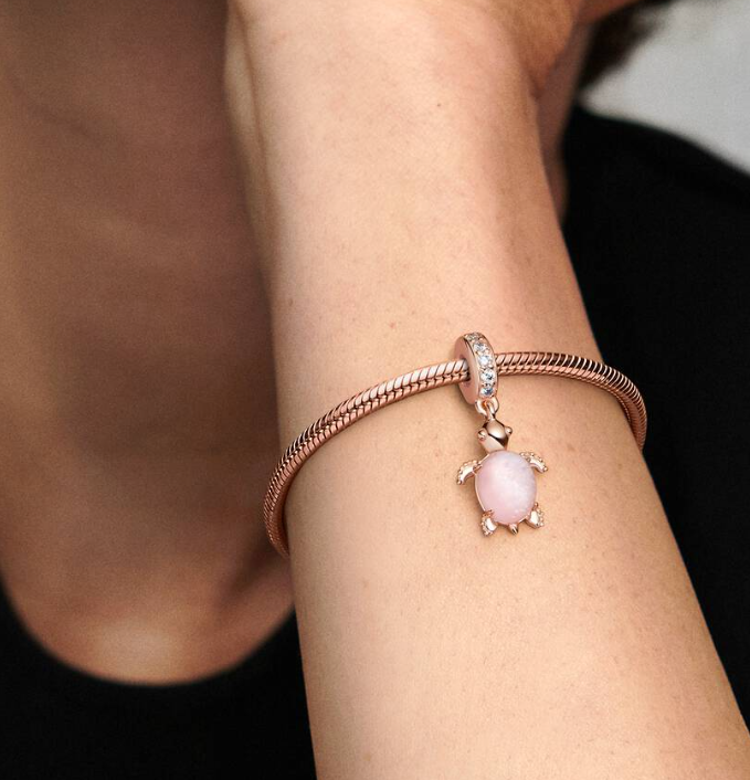 Pandora Pink Murano Glass Sea Turtle Dangle Charm in Sterling Silver with 14K Rose Gold Plating and a Cutout Heart Detail on the Underside of Turtle Shell