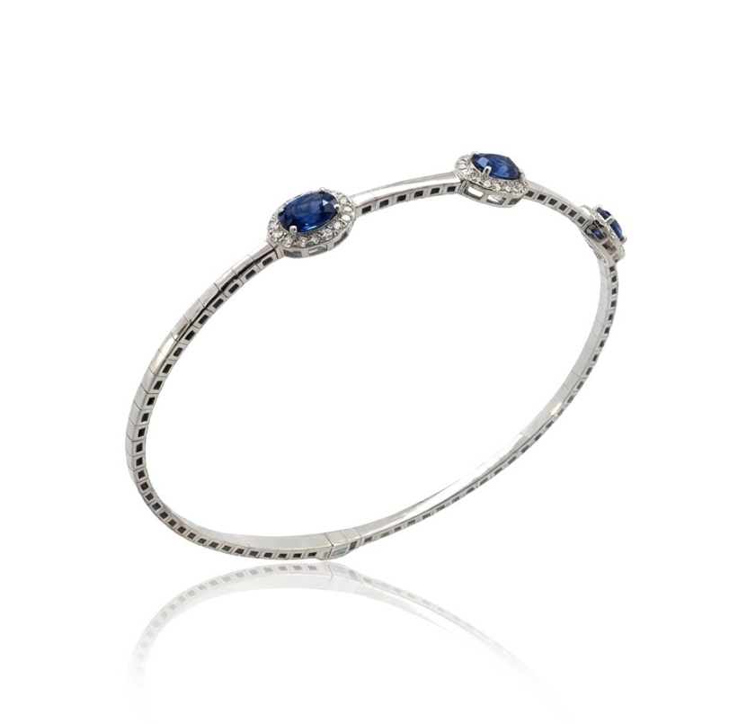 Blue Sapphire Halo Bangle | 14K White Gold | Oval Blue Sapphire & Diamond Bangle Bracelet | 1.48CT Sapphire & .25CT Diamond Accent - Brownee Jewelers