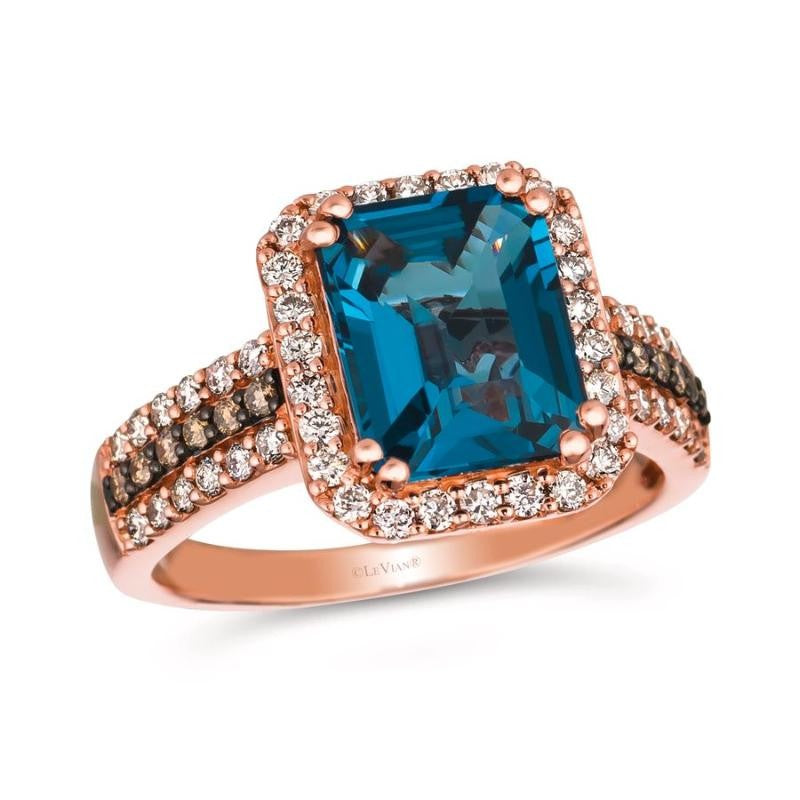 Le Vian® 14K Strawberry Gold® Ring with Deep Sea Blue Topaz™, Nude Diamonds™ & Chocolate Diamonds® Bold, radiant, and unmistakably luxurious, this Le Vian® ring showcases a breathtaking 3 1/2 ct. Deep Sea Blue Topaz™ in a dramatic emerald-cut silhouette