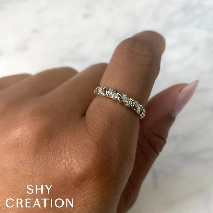  .12CT DIAMOND TWIST RING IN 14K YELLOW GOLD